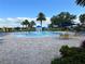 Gathering fun at the community splash pool with poolside seating, umbrellas, and nearby landscaping at 14841 Porter Rd, Winter Garden, FL 34787