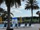 Views of neighborhood from the community pool, splash area and poolside seating with tropical palm trees at 14841 Porter Rd, Winter Garden, FL 34787
