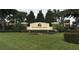 Beautiful entrance to Summerlake, featuring lush landscaping, colorful flowerbeds, and a welcoming community sign at 14841 Porter Rd, Winter Garden, FL 34787