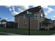 Exterior view of a two-story home at the corner of Porter Place and Seaside Sparrow Lane, featuring a screened patio at 14841 Porter Rd, Winter Garden, FL 34787