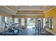 Bright gym features treadmills, weights, and an open door leading to the pool at 14841 Porter Rd, Winter Garden, FL 34787