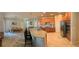 Spacious kitchen featuring a large island with seating, stainless steel appliances, and ample cabinet space at 14841 Porter Rd, Winter Garden, FL 34787