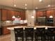 Stylish kitchen featuring granite countertops, stainless steel appliances, and a mosaic backsplash, open to the dining area at 14841 Porter Rd, Winter Garden, FL 34787