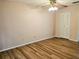 Bright bedroom with ceiling fan, wood floors, and closet at 1607 Northlake Dr # 1607, Sanford, FL 32773