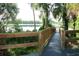 Wooden boardwalk leading to lake access with nature views and lush landscaping at 1607 Northlake Dr # 1607, Sanford, FL 32773