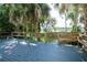 Wooden deck overlooking lake views with tropical landscaping at 1607 Northlake Dr # 1607, Sanford, FL 32773