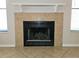 Close-up view of the fireplace with tile surround and white mantle at 1607 Northlake Dr # 1607, Sanford, FL 32773