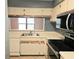 Kitchen area with stainless steel sink, white cabinets, and modern appliances at 1607 Northlake Dr # 1607, Sanford, FL 32773