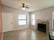 Bright living room featuring a fireplace, large windows, and tile flooring at 1607 Northlake Dr # 1607, Sanford, FL 32773