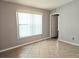 Bright living room with tile floor, window with blinds and neutral paint at 1607 Northlake Dr # 1607, Sanford, FL 32773