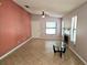 Open living room with tile flooring, fireplace, ceiling fan, and a glass table at 1607 Northlake Dr # 1607, Sanford, FL 32773