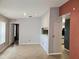 Cozy living room with tile flooring, pass-through window, and view of hall at 1607 Northlake Dr # 1607, Sanford, FL 32773