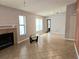 Spacious living room with tile floors, fireplace, bright windows, and view of hall at 1607 Northlake Dr # 1607, Sanford, FL 32773
