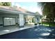 Patio with tiled flooring and a view of the green backyard landscaping at 1607 Northlake Dr # 1607, Sanford, FL 32773