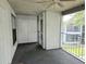 Enclosed porch with ceiling fan, carpeting, storage closet, and view of the complex at 1607 Northlake Dr # 1607, Sanford, FL 32773