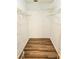 Spacious walk-in closet featuring wood floors and white shelving at 1607 Northlake Dr # 1607, Sanford, FL 32773