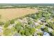 A scenic aerial shot of a charming neighborhood, featuring expansive green fields and tree-lined streets at 1617 Hontoon Rd, Deland, FL 32720