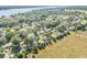 Aerial shot of the home's location, showcasing mature trees and proximity to a lake at 1617 Hontoon Rd, Deland, FL 32720