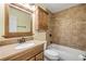 Well-maintained bathroom features tiled shower, vanity with storage, and neutral finishes at 1617 Hontoon Rd, Deland, FL 32720