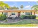 Charming single-story home with a well-maintained lawn, beautiful landscaping, and a inviting front door at 1617 Hontoon Rd, Deland, FL 32720