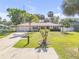 Charming single-story home with a well-maintained lawn, mature trees, and a concrete driveway at 1617 Hontoon Rd, Deland, FL 32720