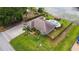 Lovely home with a private pool and gazebo, surrounded by a well-maintained lawn and wooden fence at 1802 Concert Rd, Deltona, FL 32738