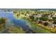 Aerial view of community homes located near a lake at 1802 Concert Rd, Deltona, FL 32738