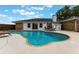 Spacious backyard with a sparkling pool, poolside loungers, and lush landscaping at 1802 Concert Rd, Deltona, FL 32738