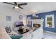 Comfortable living room with a fireplace, white sofas, and modern decor for a relaxing and stylish space at 1802 Concert Rd, Deltona, FL 32738