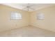 Inviting bedroom with a ceiling fan, neutral walls, natural light from two windows, and tiled flooring at 1821 Goodrich Ave, Winter Park, FL 32789