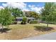 Charming single-story home with brick accents, a well-maintained lawn, and mature trees creating curb appeal at 1821 Goodrich Ave, Winter Park, FL 32789