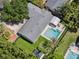 Aerial view of the home showcasing the pool, putting green, sauna, and manicured backyard at 2004 Mohawk Trl, Maitland, FL 32751