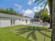 Enjoy outdoor living with this backyard oasis featuring a pool, putting green, and dining area at 2004 Mohawk Trl, Maitland, FL 32751