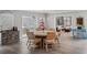 Bright dining area features hardwood floors, dining table with seating for six, and adjacent sunroom at 2004 Mohawk Trl, Maitland, FL 32751