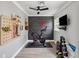 Bright exercise room features Peloton bike, decorative accent wall, and mounted TV at 2004 Mohawk Trl, Maitland, FL 32751
