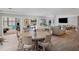 Open floor plan boasts a spacious living area, dining area with seating, and abundant natural light at 2004 Mohawk Trl, Maitland, FL 32751