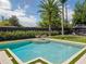Backyard oasis featuring a refreshing pool, a putting green, and a relaxing outdoor seating area at 2004 Mohawk Trl, Maitland, FL 32751