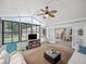 Sunroom features natural light, views of the pool, and access to the rest of the home at 2004 Mohawk Trl, Maitland, FL 32751