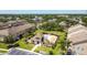A high angle shot featuring a community pool and manicured grounds amongst condos in the neighborhood at 2012 Gold Spring Cv, Kissimmee, FL 34743
