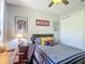 Comfortable bedroom with decoratively themed bedding and ample closet space at 2012 Gold Spring Cv, Kissimmee, FL 34743