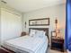 Cozy bedroom featuring a comfortable bed, stylish decor, and ample natural light from the window at 2012 Gold Spring Cv, Kissimmee, FL 34743