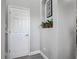 Hallway niche with plants, adding a touch of greenery and charm to the interior space at 2012 Gold Spring Cv, Kissimmee, FL 34743