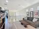 Bright living room with views of downstairs, featuring a decorative coffee table and modern furnishings at 2012 Gold Spring Cv, Kissimmee, FL 34743
