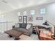 Bright living room space with decorative wall art, comfortable seating, and a functional work area at 2012 Gold Spring Cv, Kissimmee, FL 34743