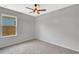 Bedroom showcasing neutral walls, carpeted flooring, and a bright window at 2308 Glenbrook Chase Blvd, Lakeland, FL 33811