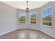 Bright dining area with three large windows providing lots of natural light and lovely exterior views at 2308 Glenbrook Chase Blvd, Lakeland, FL 33811