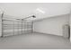 Spacious garage with epoxy flooring, automatic door opener, and water heater at 2308 Glenbrook Chase Blvd, Lakeland, FL 33811