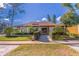 Front exterior of clubhouse with manicured landscaping and a ramp at 2348 Sun Valley Cir, Winter Park, FL 32792