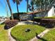 Exterior view of Cedarwood Village Condominiums signage with landscaping on a clear, sunny day at 2348 Sun Valley Cir, Winter Park, FL 32792