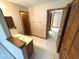Hallway with marble flooring and wooden doors leading to a bathroom at 2348 Sun Valley Cir, Winter Park, FL 32792